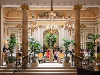 The Ritz Hotel, London. The Palm Court, which serves 'Tea at the Ritz'. Afternoon tea