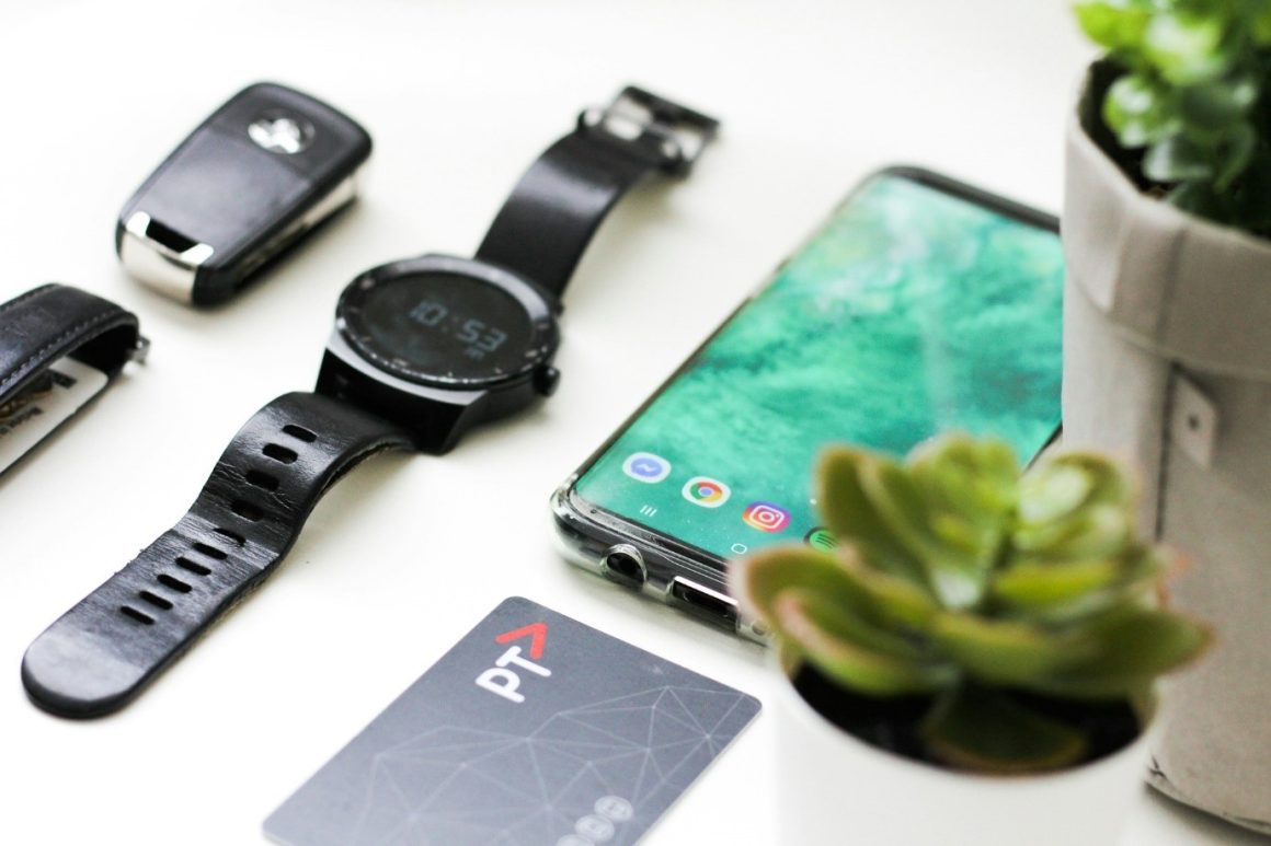 Gadgets for travel laid out on a table. 