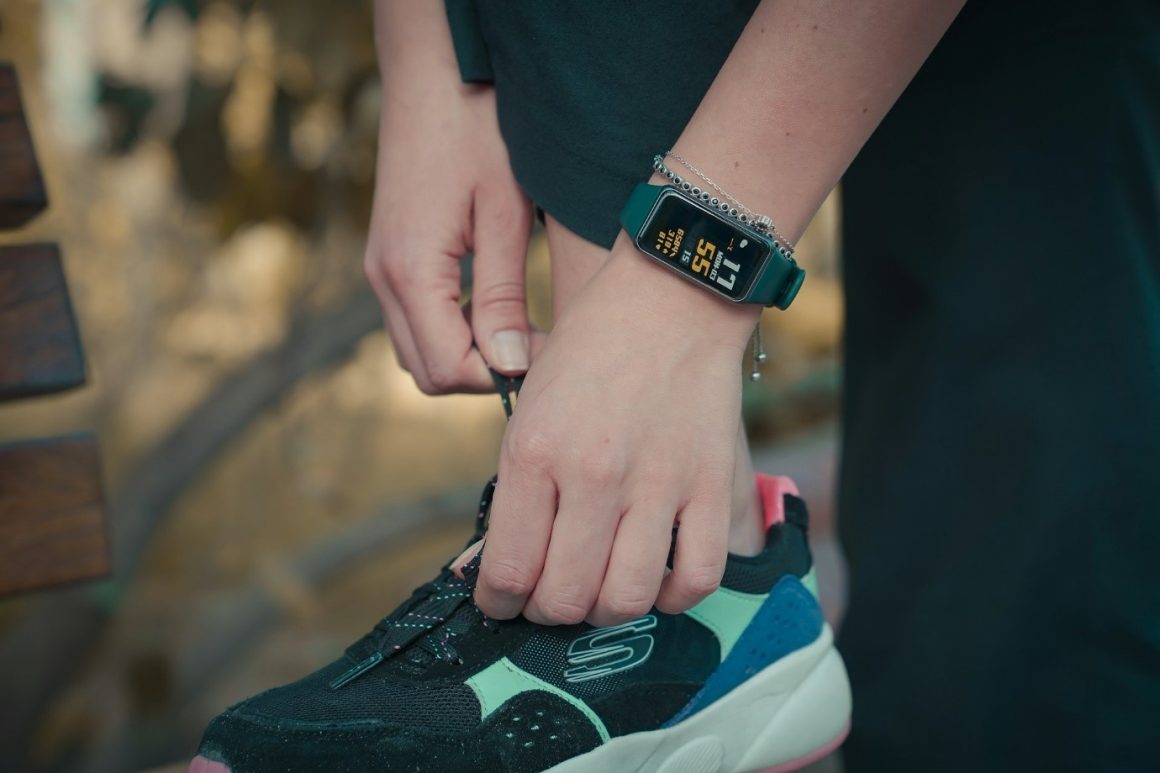 A runner using a fitness tracker.  