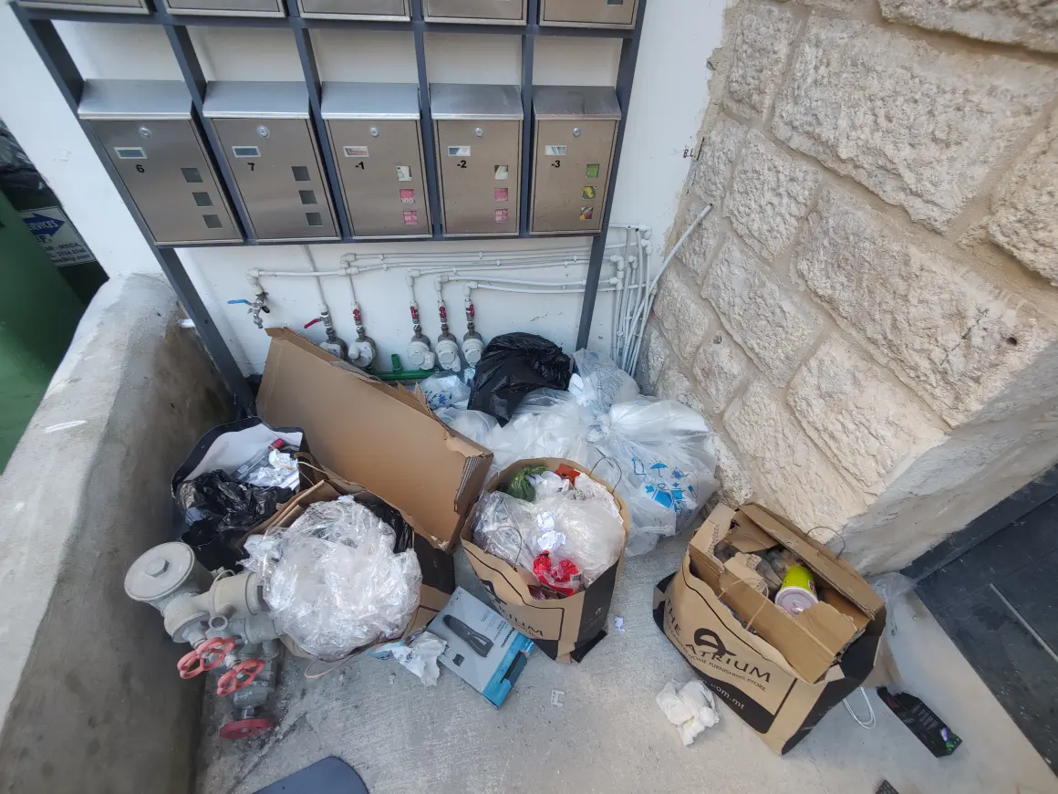 Malta garbage next to rented flat St Gilian