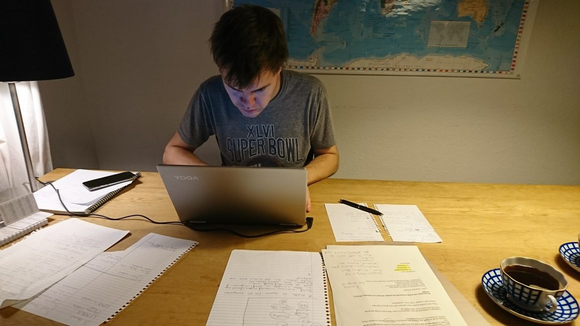 digtal nomad works on a laptop remotely in a city