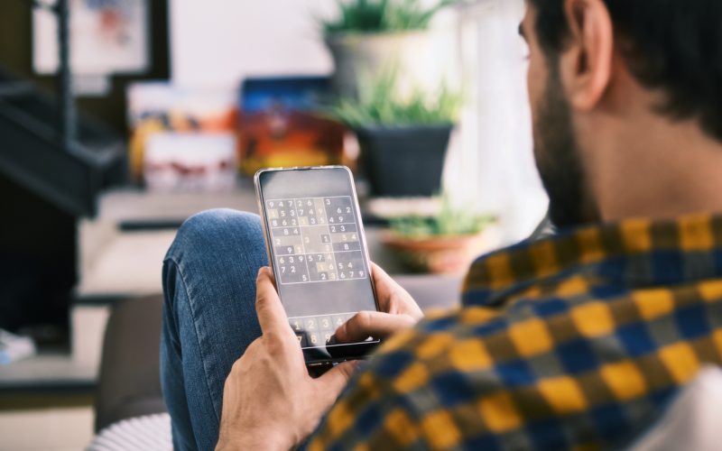 playing puzzle game on phone in usa