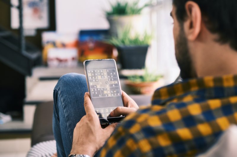 playing puzzle game on phone in usa