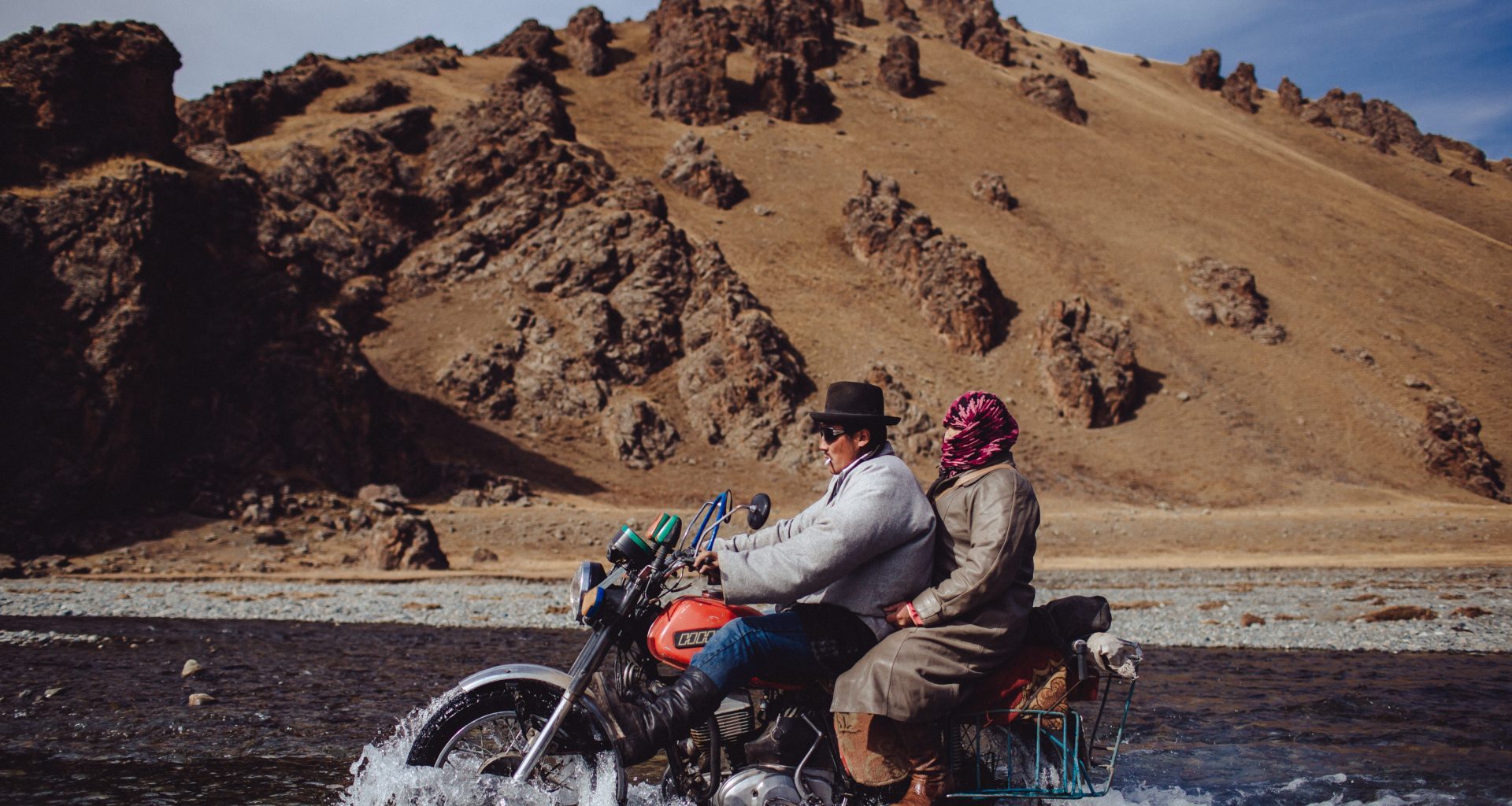 Crossing a river on a motorbike in Mongolia