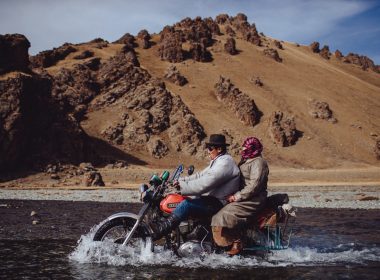 Crossing a river on a motorbike in Mongolia