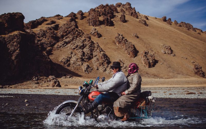 Crossing a river on a motorbike in Mongolia
