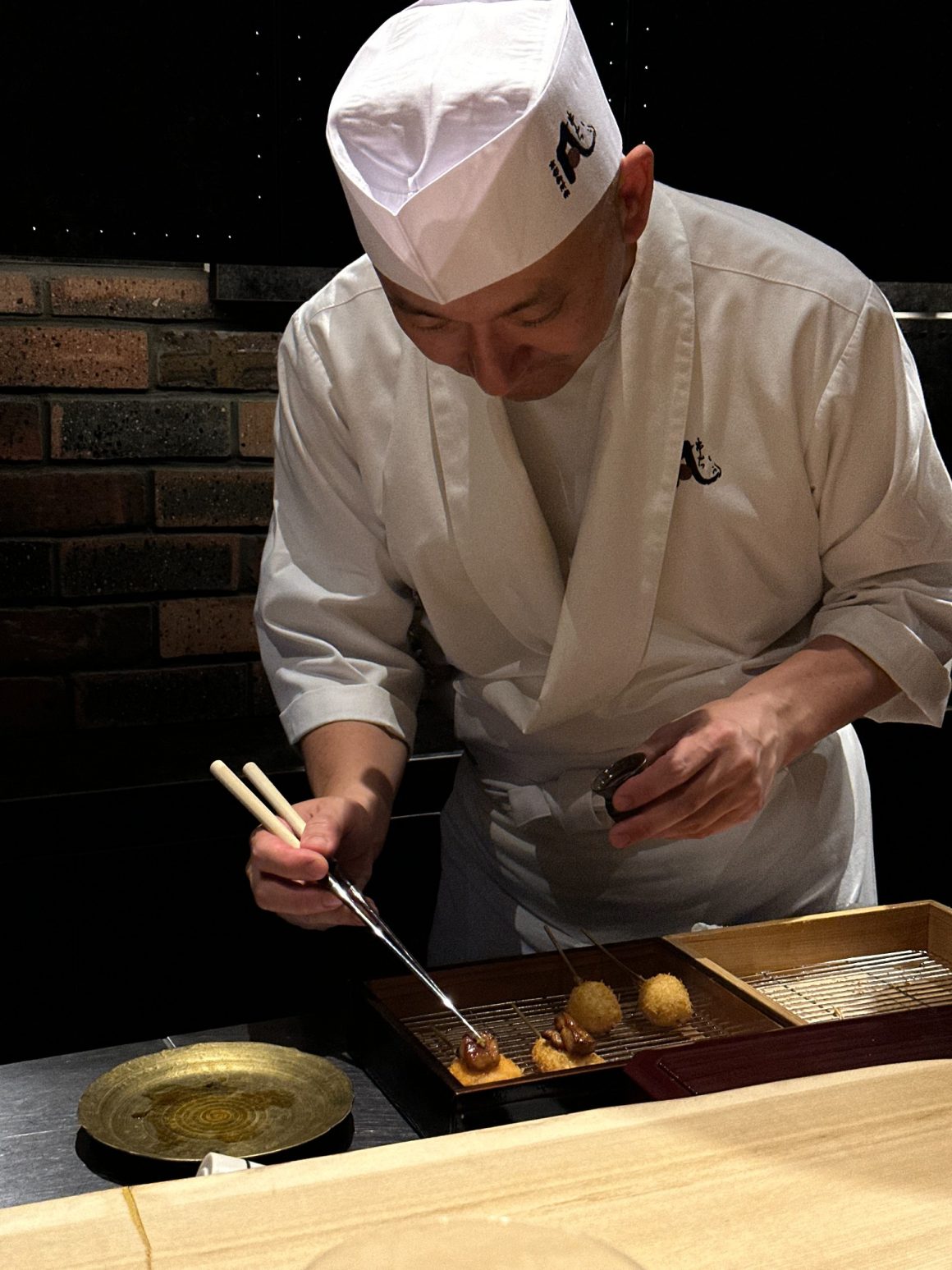 Chef preparing kushikatsu during an omakase dinner in Kyoto