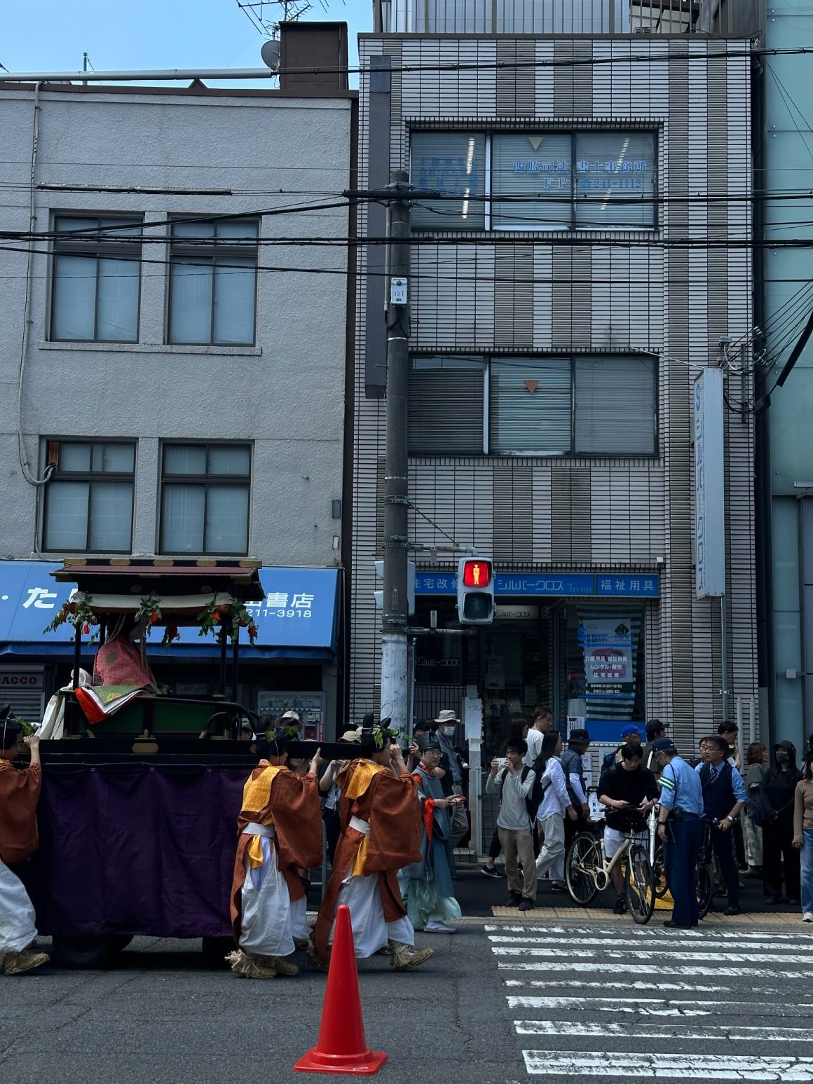 Traditional procession during a Kyoto festival with participants in historic costumes