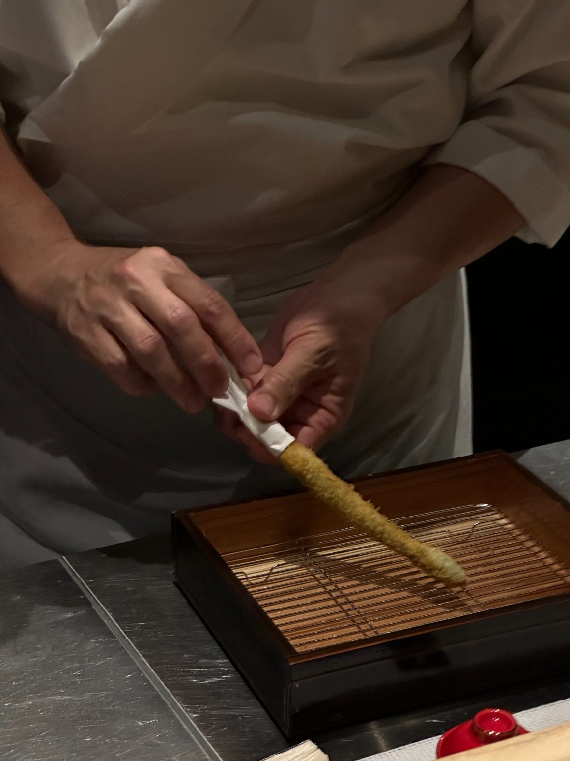Chef frying a kushikatsu skewer in Kyoto