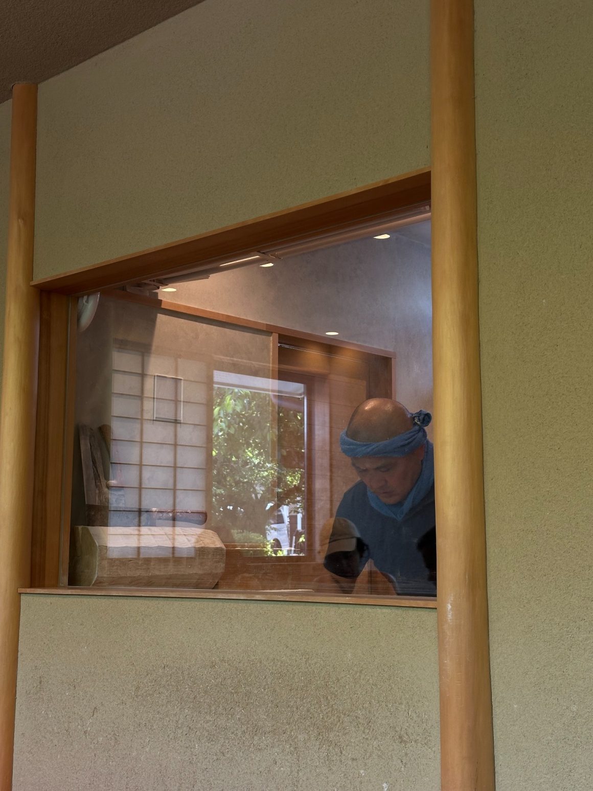 Traditional Japanese craftsman working in a Kyoto workshop