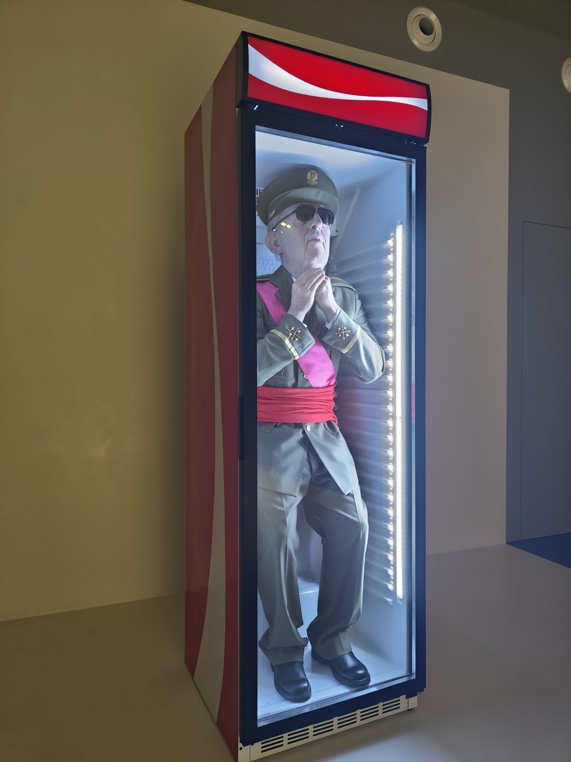 It's Eugenio Merino's Always Franco, depicting Spanish dictator Francisco Franco standing inside a Coca-Cola refrigerator. Photo by Locals Insider from Museu de l'Art Prohibit, Barcelona