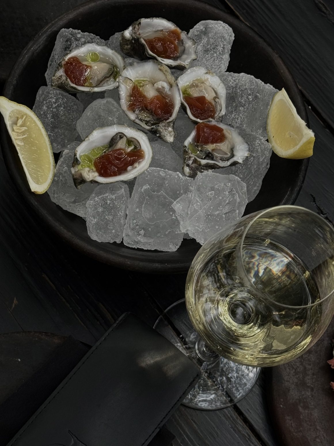 Oysters on ice with a glass of wine at Canopia in Mexico City