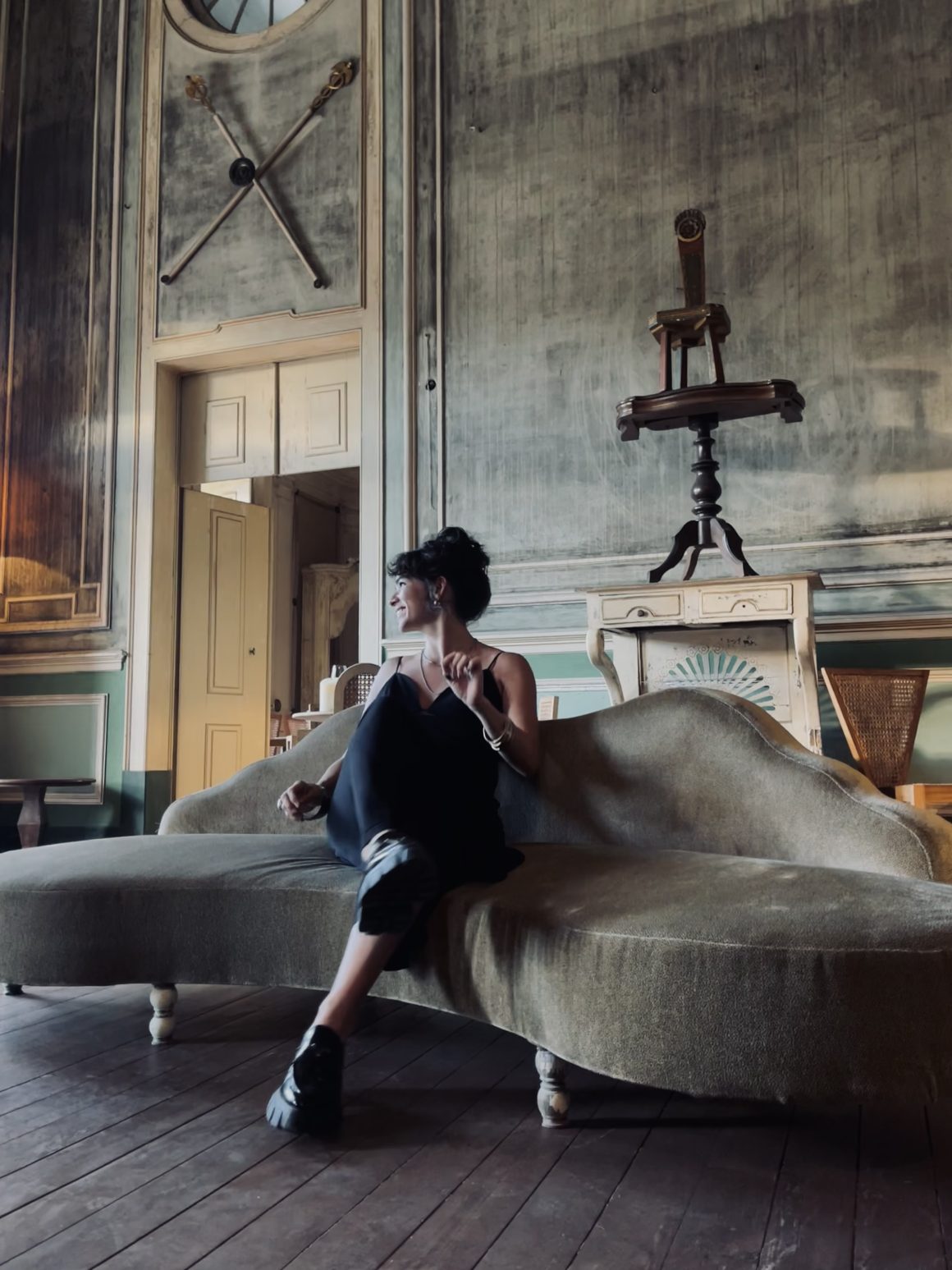 Maria del Rosio Bribiesca Contreras sitting in a historic interior