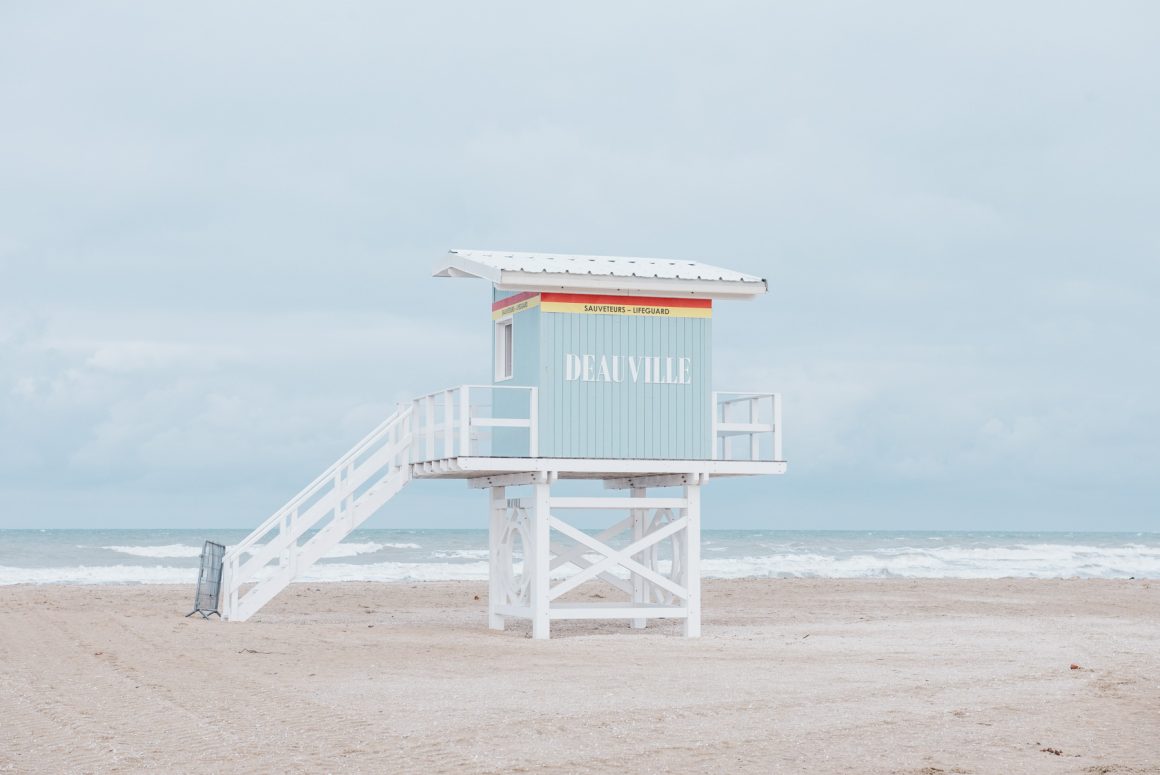 A pale blue lifeguard station on the beach in Deauville, Normandy. Photo by Hélène Havard.