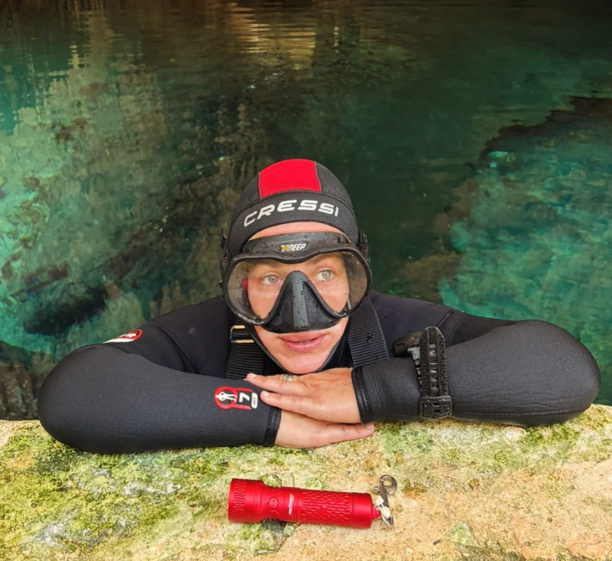 Eva, a local scuba diving instructor in Tulum, takes a moment at the surface of one of the Riviera Maya’s cenotes.