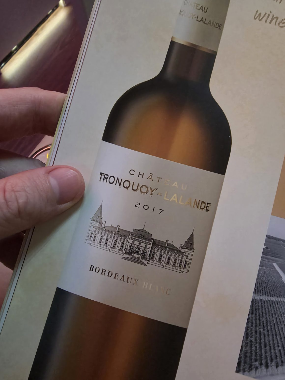 Château Tronquoy-Lalande 2017 Bordeaux wine bottle in a wine book.