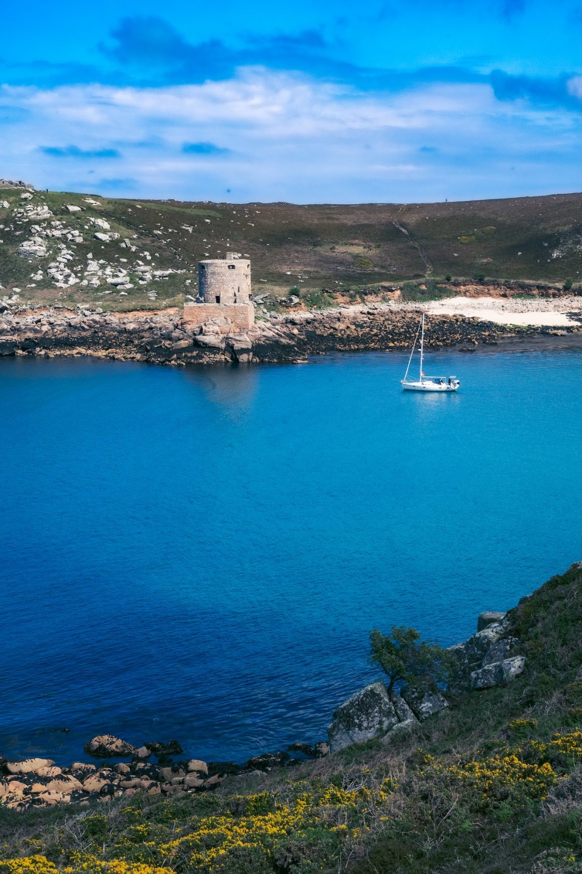The Bryher hike offers stunning views of Cromwells Castle in Tresco.