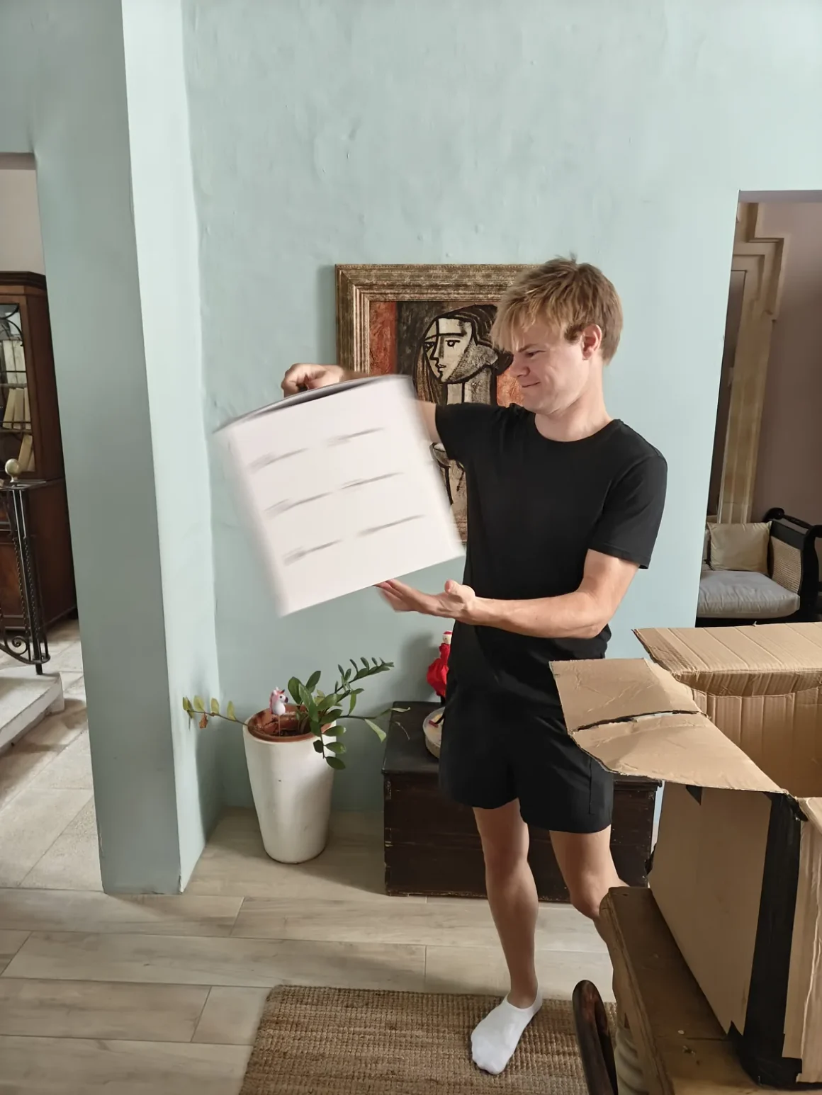 Unpacking moving boxes in a Maltese townhouse after moving to Malta as a digital nomad